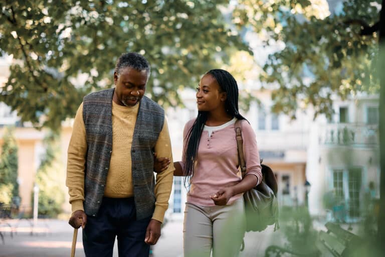 stock photo of elderly man and woman walking together